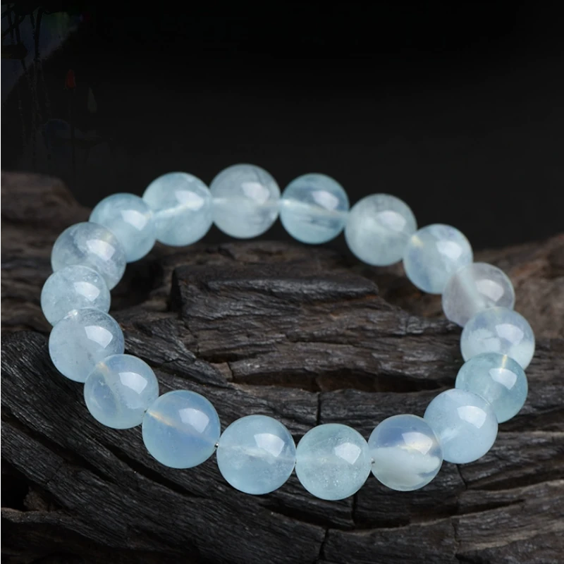 Aquamarine beaded bracelet placed on a branch beautifully